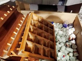 Two boxes of mixed thimbles and thimble racks, approximately 300+ thimbles. Not available for in-