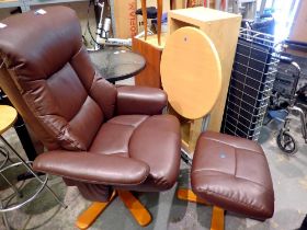 Brown leather office chair and a matching foot stool with wood tuned feet. Not available for in-