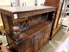 Carved oak sideboard, two drawers, four cupboards. Not available for in-house P&P