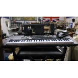 Yamaha EZ-220 digital keyboard, with case stand, pedal and headphones. All electrical items in