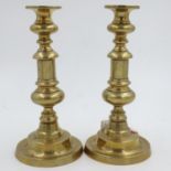 Pair of early brass candlesticks with pushers, H: 26 cm. UK P&P Group 2 (£20+VAT for the first lot