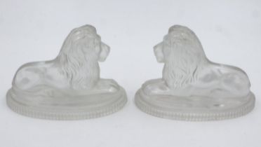 Pair of glass lions by John Derbyshire with Victorian lozenge mark, L: 19 cm, small crack to one and