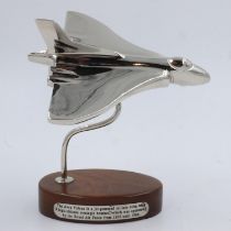 Chrome Vulcan bomber on wooden base, L: 19 cm. UK P&P Group 2 (£20+VAT for the first lot and £4+