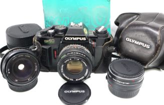 Olympus OM40 camera with additional lenses, including Zeiss 28 mm. UK P&P Group 2 (£20+VAT for the