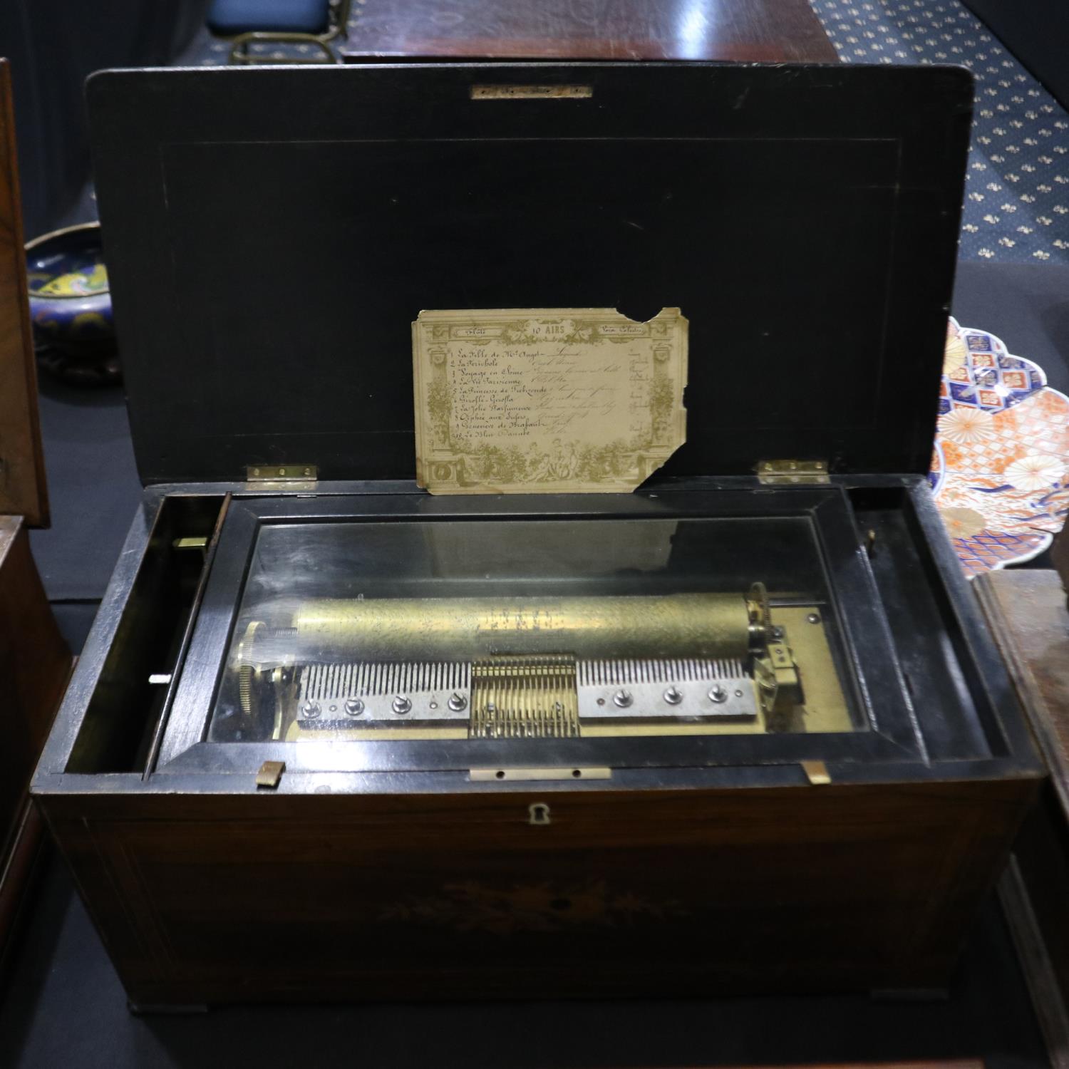 ***WITHDRAWN***Swiss music box playing ten tunes in an inlaid walnut case, L: 61 cm. Not available