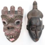 A tribal art wooden mask from Cameroon and another depicting far eastern dragon mask. UK P&P Group 2
