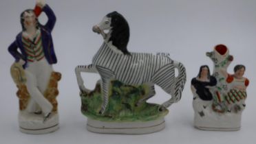 Unusual 19th century Staffordshire zebra and two figural examples, some chips noted. UK P&P Group