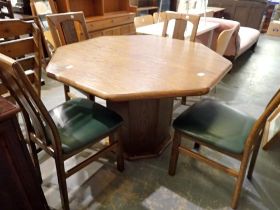 Hexagonal oak table and four upholstered chairs. Not available for in-house P&P
