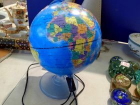 Electric illuminated rotating globe. All electrical items in this lot have been PAT tested for