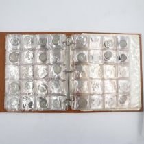 Pre decimal coin collectors album with mixed denominations including over forty coins with silver