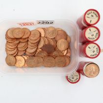 Four rolls of uncirculated halfpenny coins with a further fifty loose coins with good lustre. UK P&P