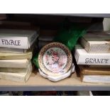 Shelf of mixed plates including Wedgwood. Not available for in-house P&P