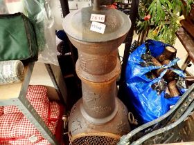 Cast iron chimenea with three bags of dried wood. Not available for in-house P&P