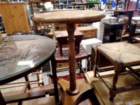 Circular oak table on turned support with tripod base. Not available for in-house P&P