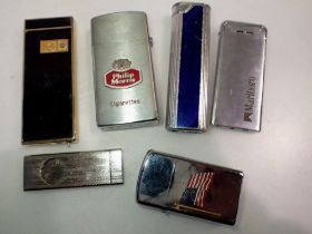 Five mixed lighters and a cigar clipper. UK P&P Group 1 (£16+VAT for the first lot and £2+VAT for