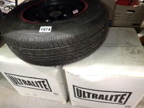 Set of four boxed Ultralite alloys & a wheel and tyre. Not available for in-house P&P