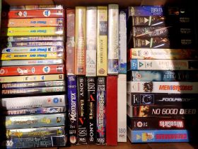 Box of mixed DVDs and VHS tapes to include Futurama. Not available for in-house P&P