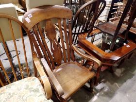 An elm rocking chair with shaped seat and a pierced back rail. Not available for in-house P&P