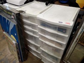 Three Contico plastic shelving units with contents including PC hardware. Not available for in-house