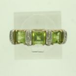 Contemporary 9ct gold ring set with peridot and diamonds, size P, 3.0g. P&P Group 0 (£6+VAT for