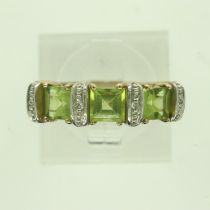 Contemporary 9ct gold ring set with peridot and diamonds, size P, 3.0g. P&P Group 0 (£6+VAT for