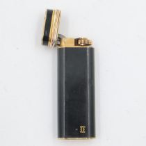 Cartier Trinity black enamelled lighter, numbered 79006V. Chips to lacquer on body and overall