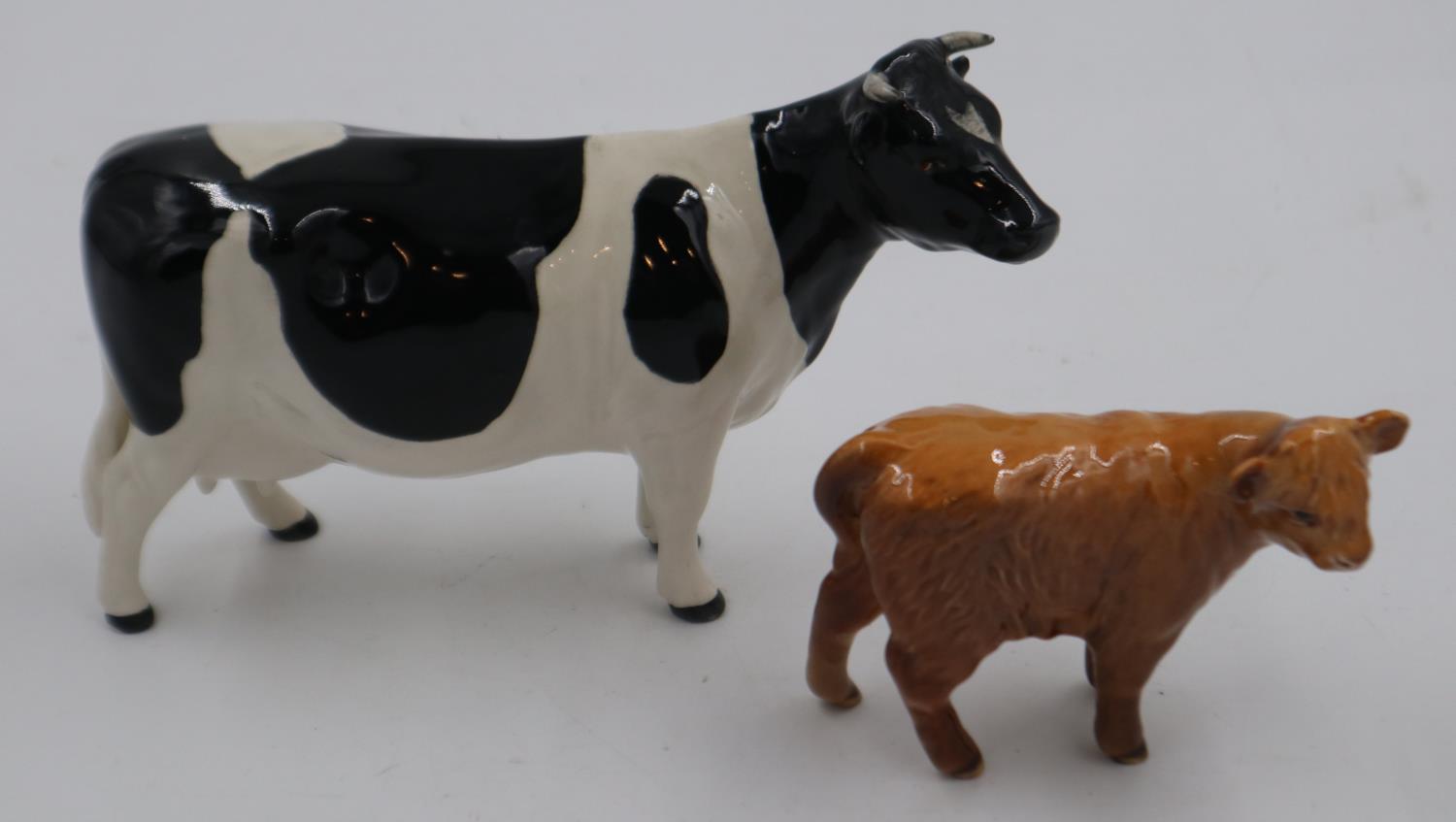 Beswick Fresian cow and a Beswick calf. UK P&P Group 2 (£20+VAT for the first lot and £4+VAT for