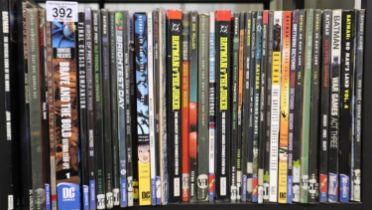Shelf of superhero graphic novels. UK P&P Group 3 (£30+VAT for the first lot and £8+VAT for
