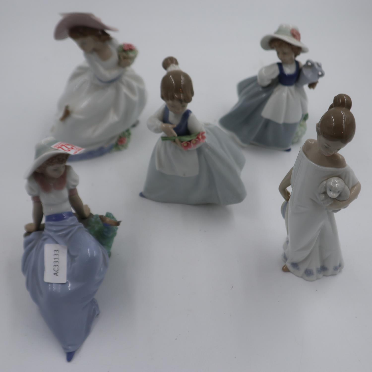 Five mixed Nao figurines, largest 21 cm, no cracks or chips. Not available for in-house P&P