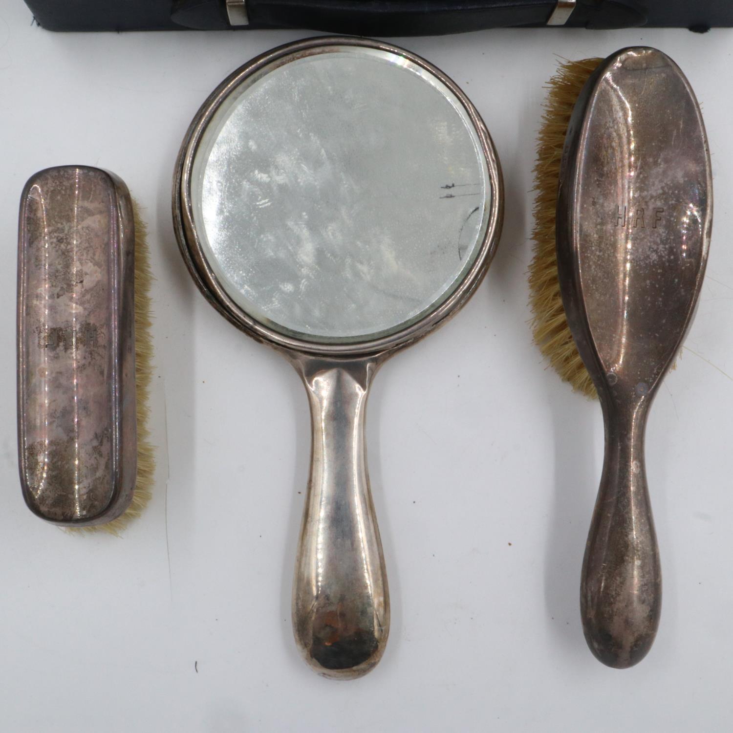 Hallmarked silver vanity set comprising brushes and a mirror in a case, mirror with damage. UK P&P - Image 2 of 2