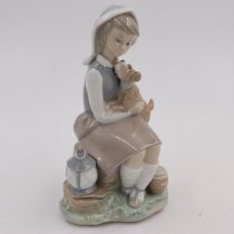Lladro figure of a girl with dog, H: 21 cm, no cracks or chips. UK P&P Group 1 (£16+VAT for the