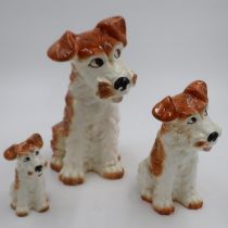Three Sylvac dogs, largest H: 30 cm, one head re-glued. UK P&P Group 3 (£30+VAT for the first lot