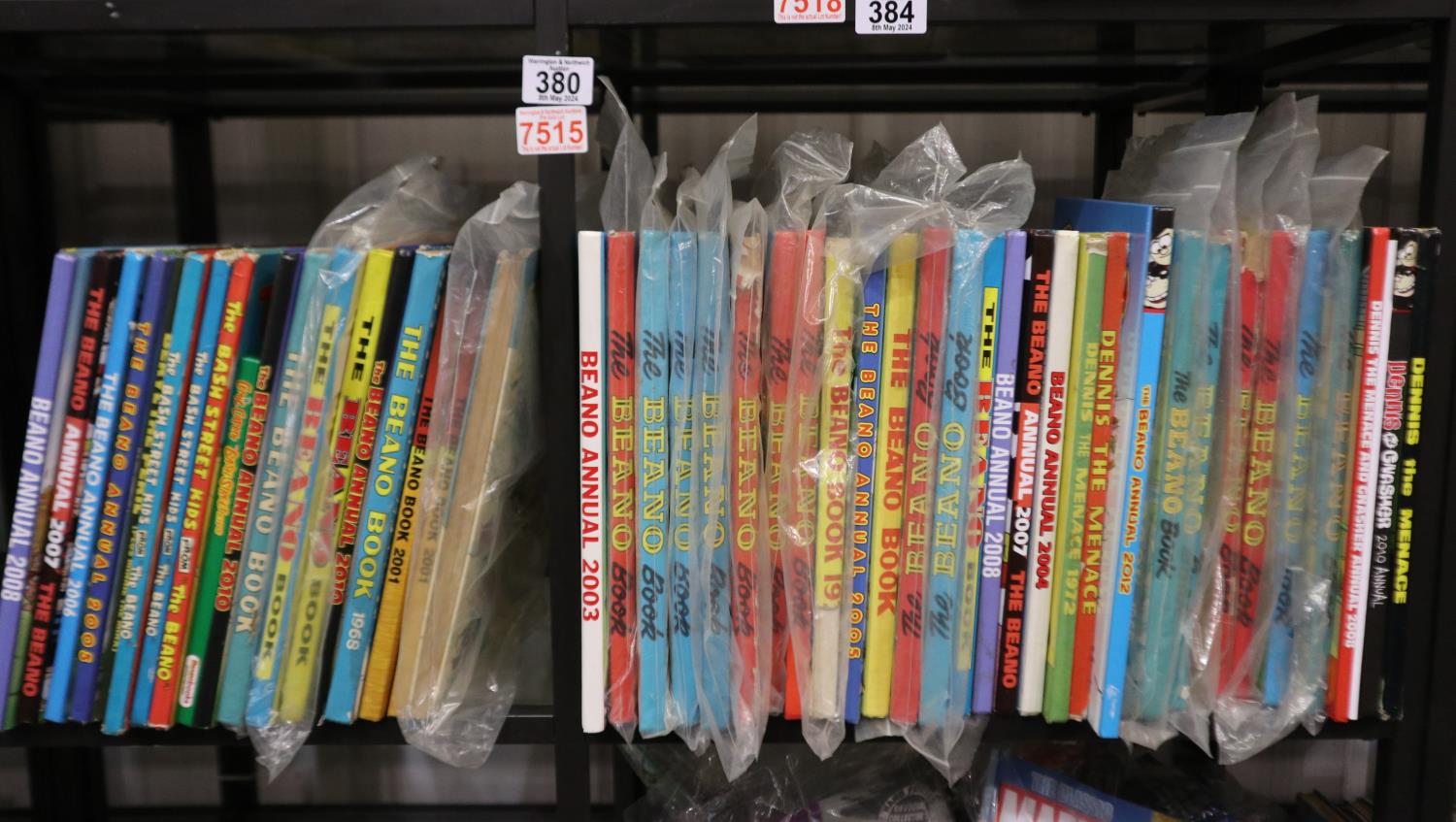 Two shelves of Beano annuals. Not available for in-house P&P