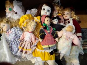 Ten mixed porcelain dolls. Not available for in-house P&P
