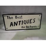 Cast iron Best Antiques Are Old Friends sign. L: 25 cm.UK P&P Group 2 (£20+VAT for the first lot and