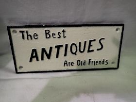 Cast iron Best Antiques Are Old Friends sign. L: 25 cm.UK P&P Group 2 (£20+VAT for the first lot and