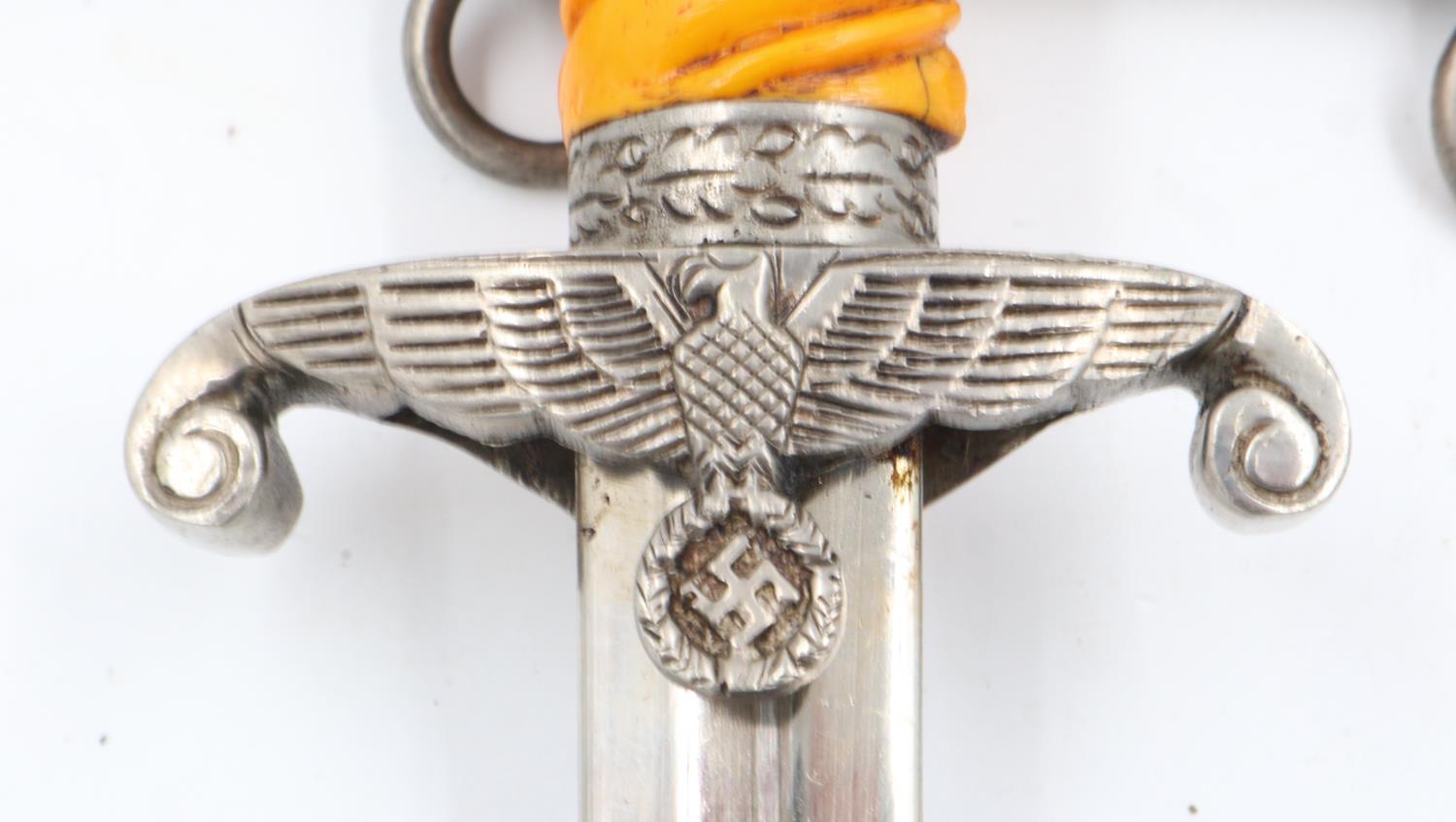 Third Reich late WWII unmarked Heer (Army) Officers dagger, with orange celluloid grip, pommel and - Image 2 of 2