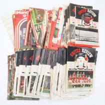 A large quantity of United Review and Manchester United programmes. UK P&P Group 3 (£30+VAT for