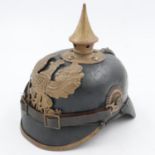 WWI 1895 model Imperial German pickelhaube with chinstrap and cockades. unit marked to the 70th