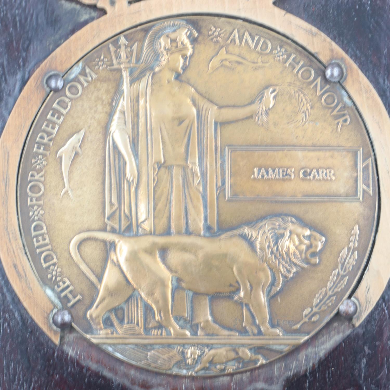 British WWI bronze death plaque named to James Carr, mounted to an oak wall frame (with faults). - Image 2 of 2