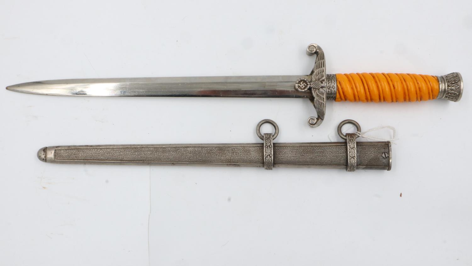 Third Reich late WWII unmarked Heer (Army) Officers dagger, with orange celluloid grip, pommel and