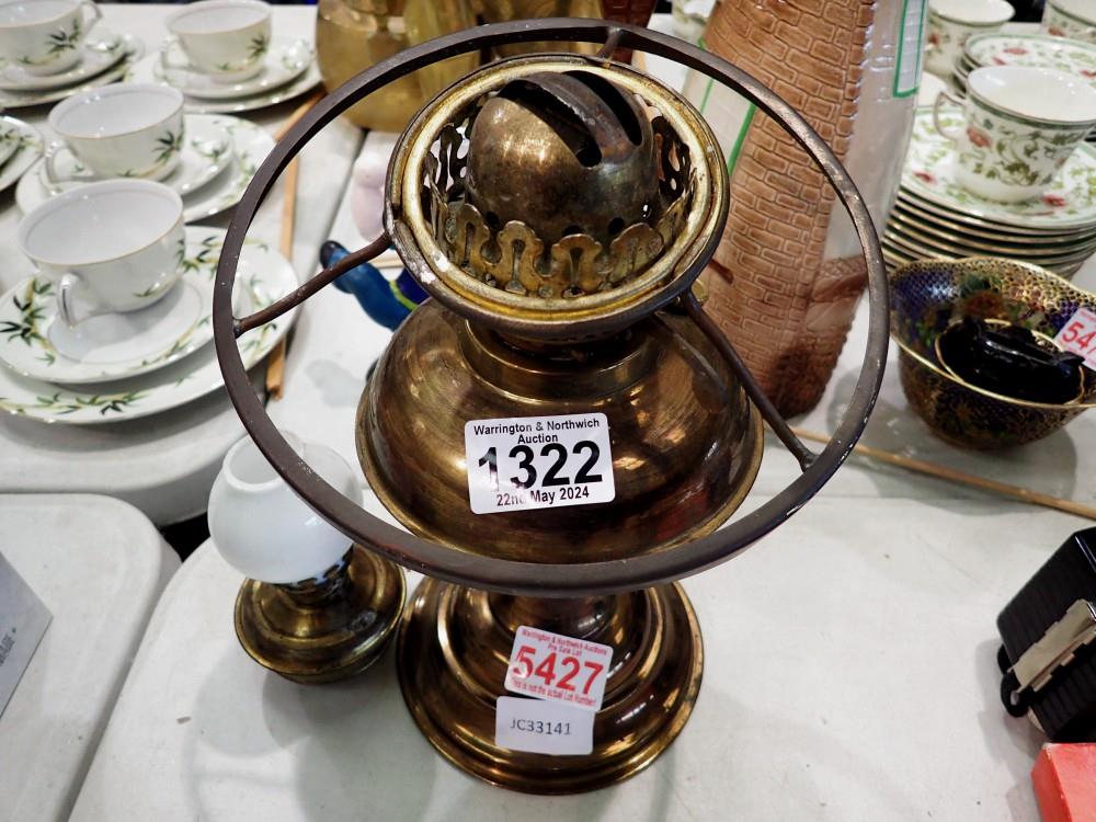 Two oil burning brass lamps. Not available for in-house P&P