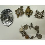 Small collection of mixed collectables to include military cap badges, 925 silver charm bracelet and