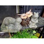 Stone otter garden ornament and a squirrel. Not available for in-house P&P
