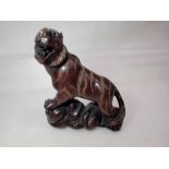 Carved Japanese hardwood tiger netsuke. UK P&P Group 1 (£16+VAT for the first lot and £2+VAT for