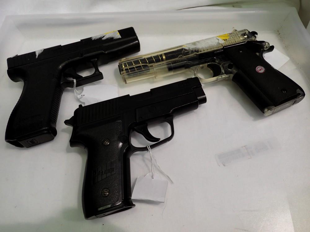 Three spring powered airsoft pistols KWC, Tokyo Marui and a Sig Sauer P228. UK P&P Group 2 (£20+