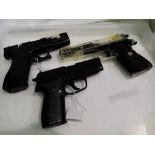 Three spring powered airsoft pistols KWC, Tokyo Marui and a Sig Sauer P228. UK P&P Group 2 (£20+