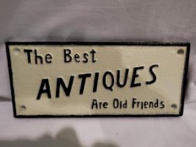 Cast iron sign The Best Antiques Are Old Friends, L: 24 cm. UK P&P Group 1 (£16+VAT for the first