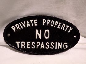 Cast iron oval No Trespassing sign, L: 24 cm. UK P&P Group 1 (£16+VAT for the first lot and £2+VAT