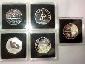 Five 50p commemorative coins in Quadrium cases. UK P&P Group 0 (£6+VAT for the first lot and £1+